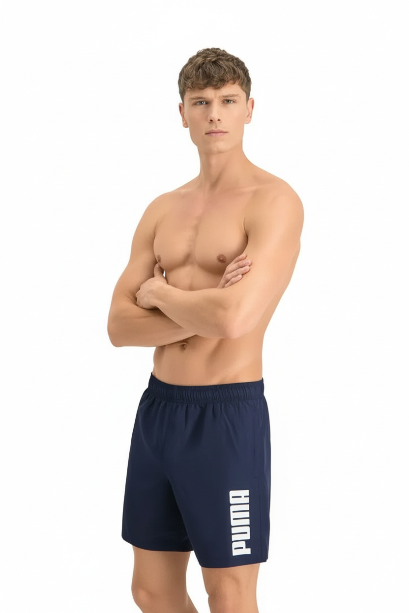 an image of a shirtless man standing with his arms crossed