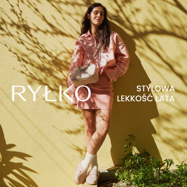 Woman in pink outfit with handbag against yellow wall, RYŁKO summer style.