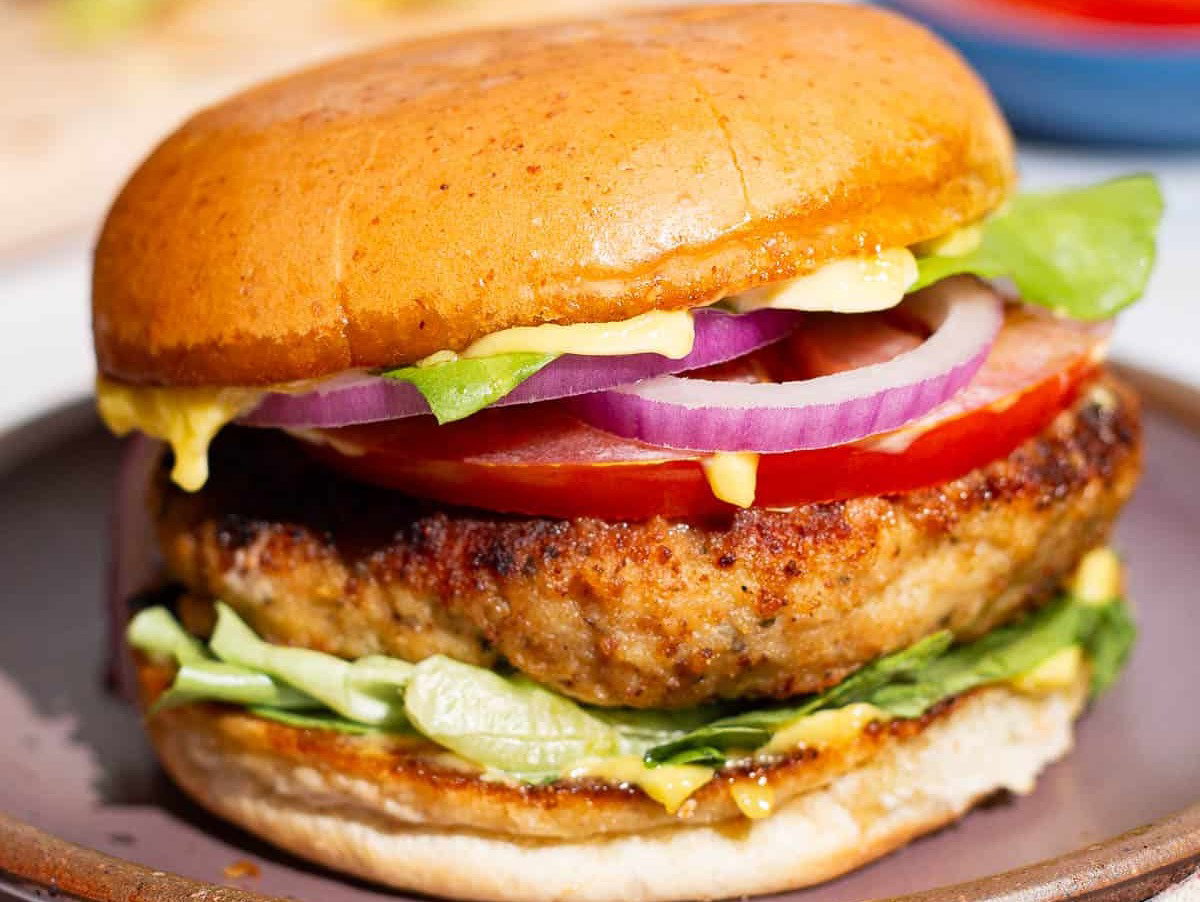 A chicken burger on a plate.
