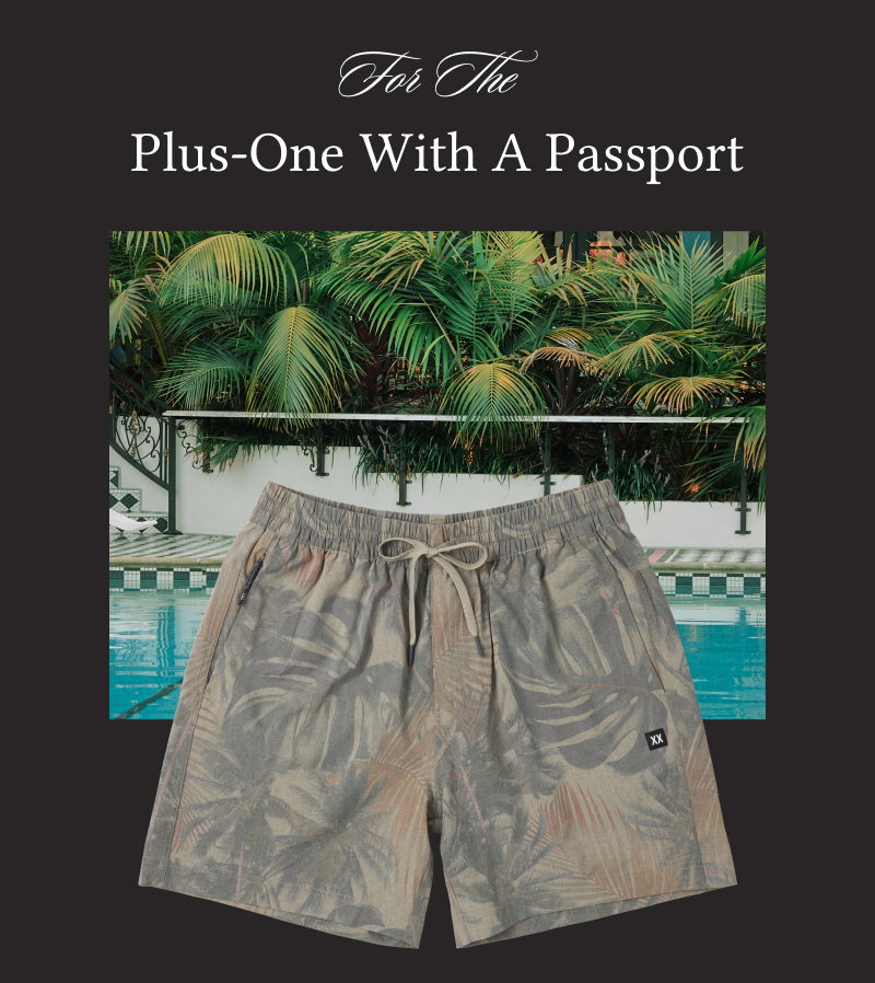 “For The Plus-One With A Passport” featuring tropical print swim shorts beside a luxury poolside scene.