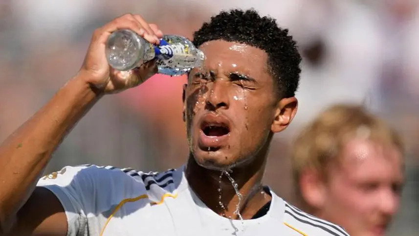 Jude Bellingham pours water over his face as he closes his eyes while playing for Real Madrid at the Club World Cup.