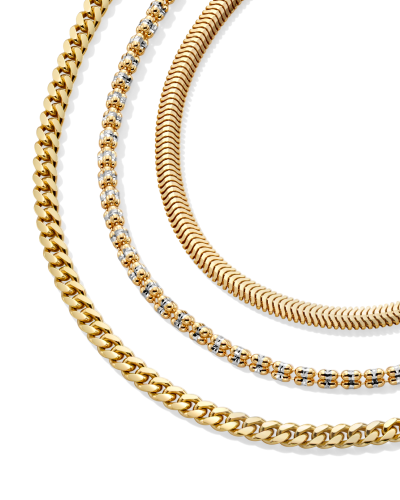Woman wearing variety of yellow gold fine jewelry.