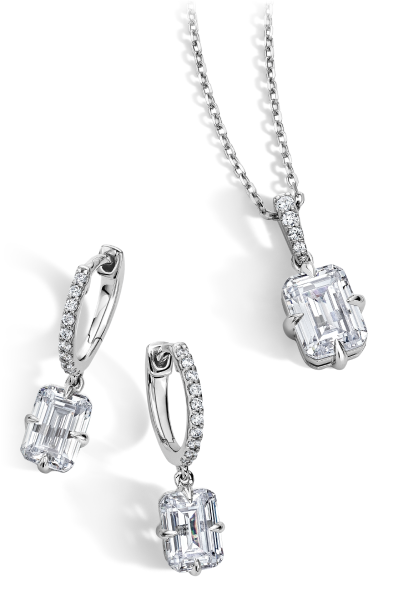 Neil Lane white gold emerald cut diamond pendant necklace on delicate chain with matching drop hoop earrings.