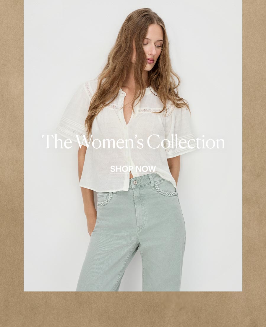 Shop The Women's Collection - Featuring an image of a woman wearing a white short sleeve button up shirt paired with light minty green denim jeans with braided pocket detailing all by PAIGE. With a warm, beige textured wall as a background image.