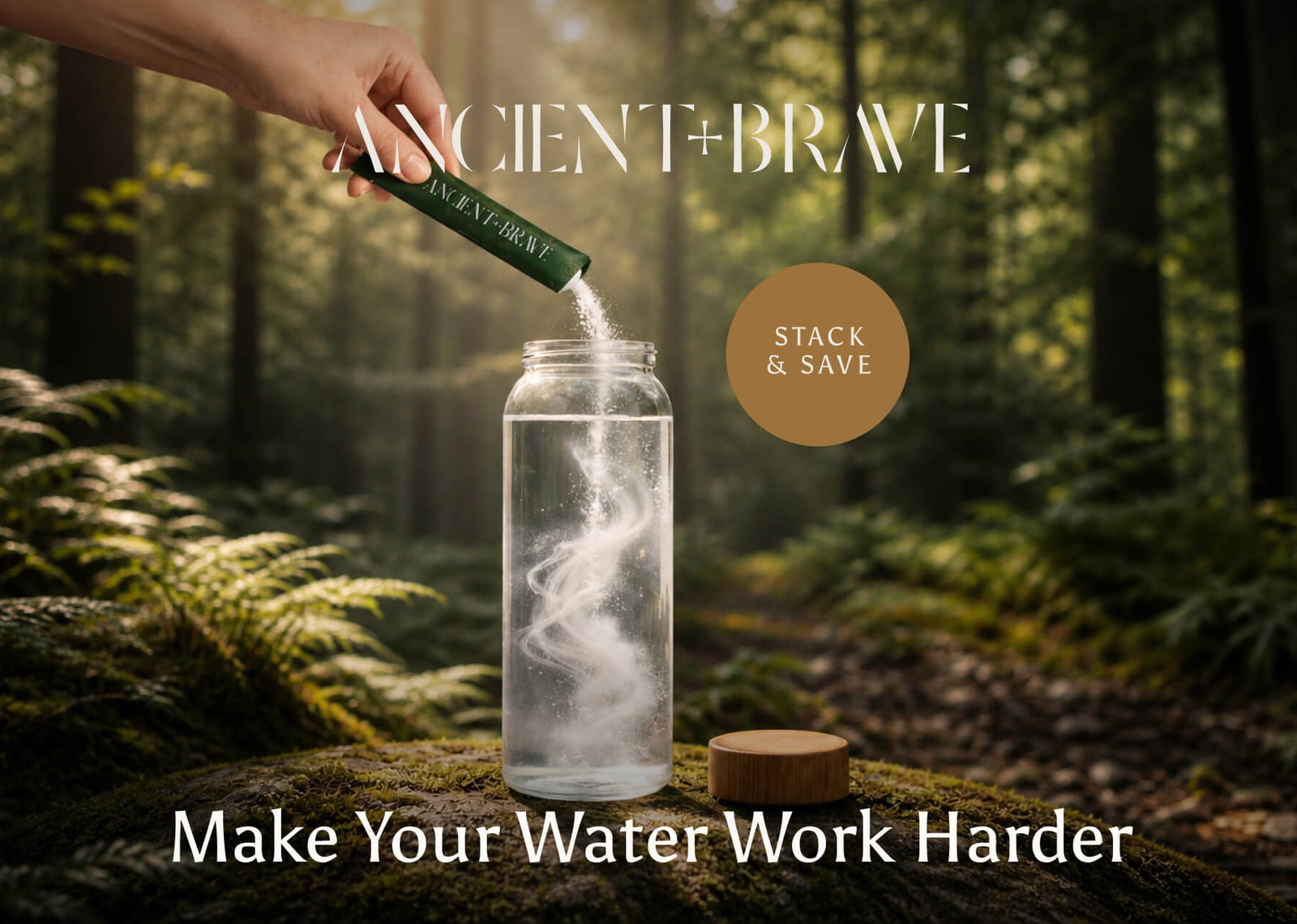 Ancient + Brave. A hand pours a sachet of powder into a glass water bottle on a mossy forest floor, with white wisps swirling through the water. Stack & Save. Make Your Water Work Harder.