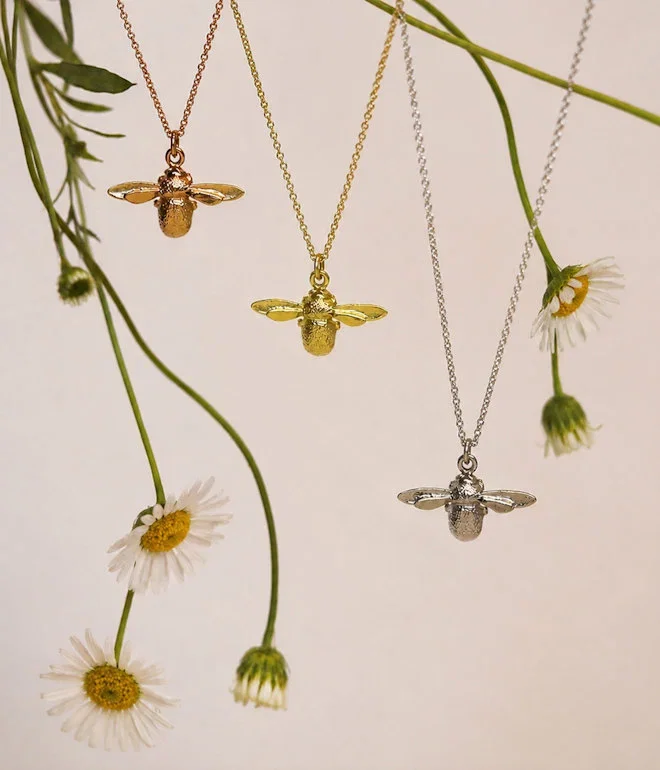 World Bee Day (picture of three bee necklaces)
