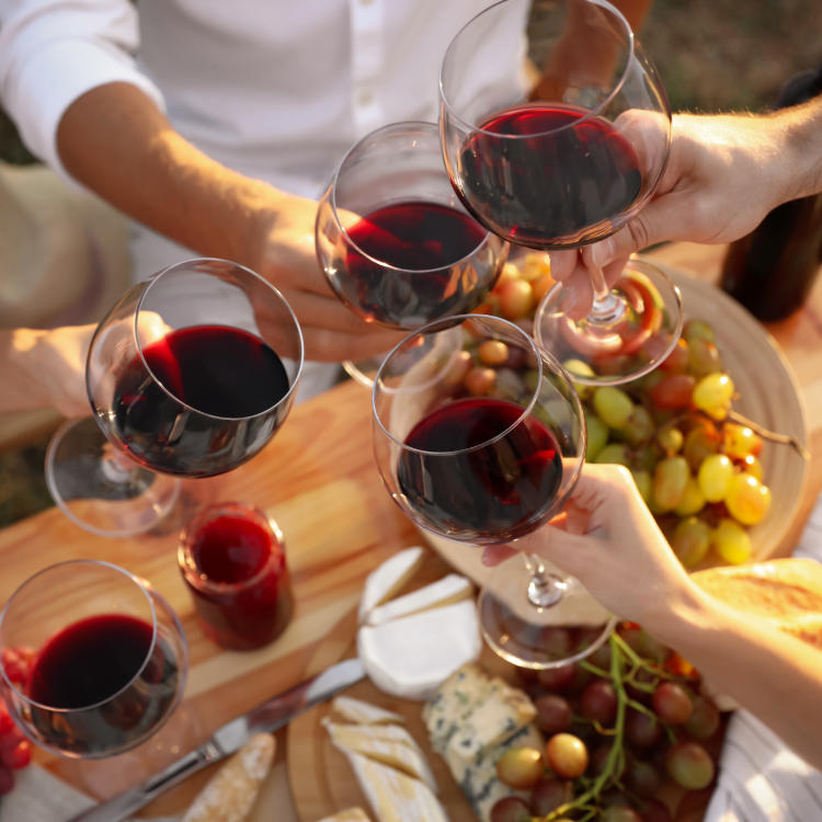 People with glasses of red wine 