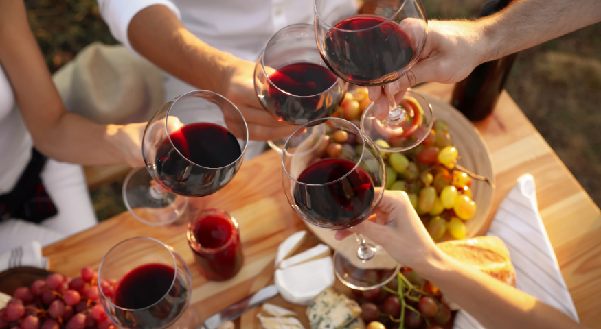 People with glasses of red wine 