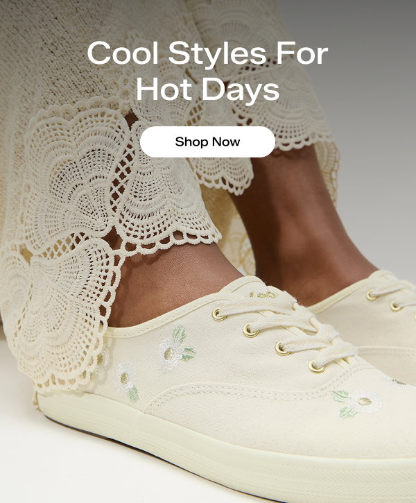 A close-up view of the Keds Champion Canvas Floral Embroidery Lace-Up in egret shown on foot paired with cream crochet pants. Text on the image says Cool Styles For Hot Days. Shop Now.