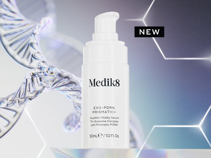 Medik8 Exo-PDRN Prismatic+ Youthful Vitality Serum pump bottle displayed beside a stylised DNA strand with a ‘NEW’ label against a soft iridescent background.