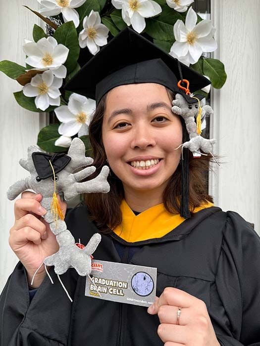 Grad student holding Brain Cells