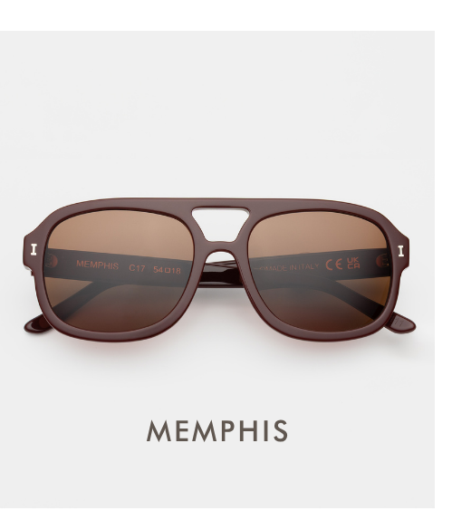 A clean, centered studio product shot of the Memphis sunglasses. The frames are deep bordeaux with a double bridge and warm brown-tinted lenses. The word 