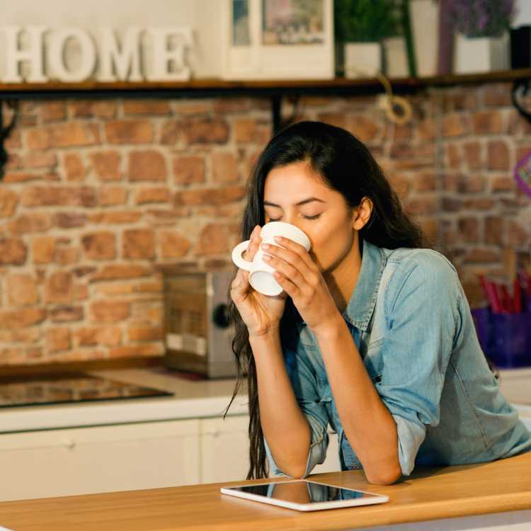 Morning Mindfulness - a woman enjoys coffee