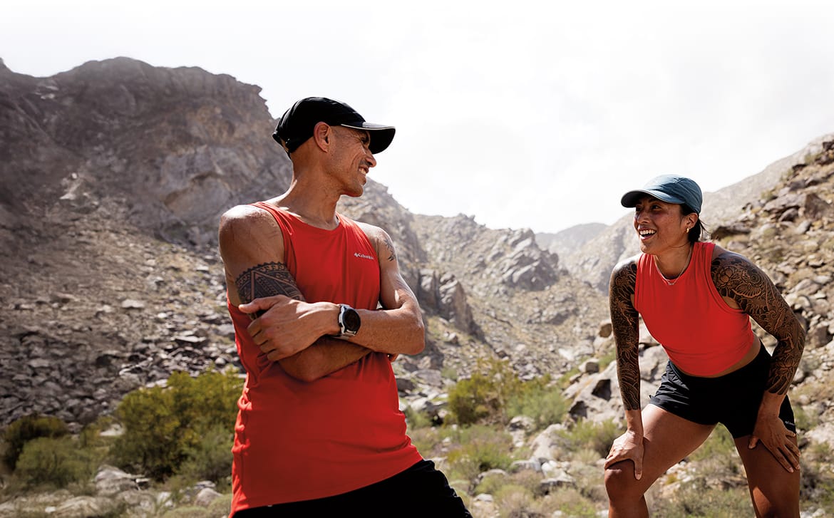 Man and woman in a rocky wilderness. 
