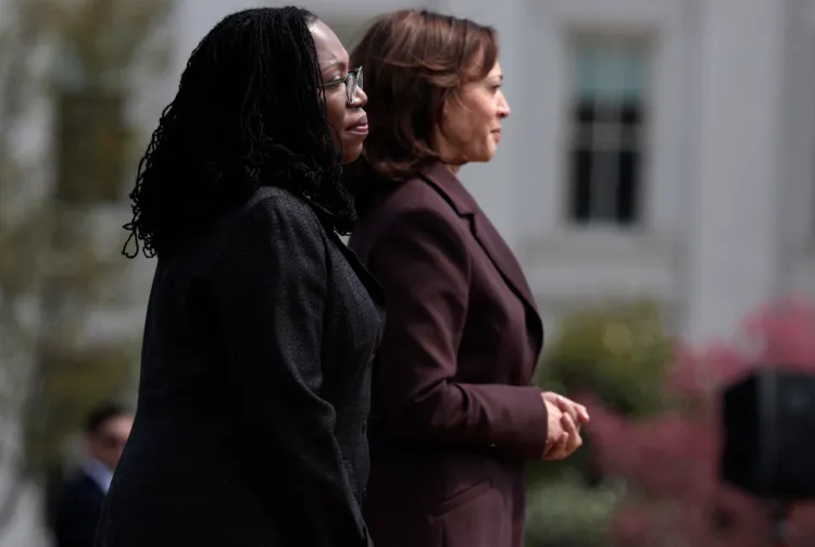 Ketanji Brown Jackson stands next to then-Vice President Kamala Harris
