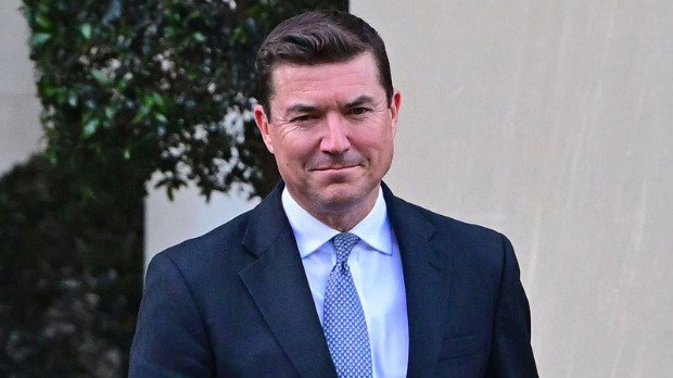 James Roscoe, Deputy Head of Mission at the British Embassy in Washington in April 2026. He is wearing a dark blue suit with a light blue tie as he faces the camera.