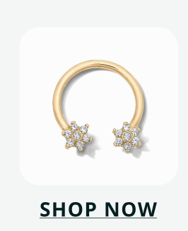 Gold horseshoe barbell featuring two flower-shaped stones. Click here to shop now
