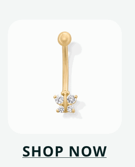 A gold curved barbell featuring a butterfly-shaped stone cluster at the bottom end. Click here to shop now