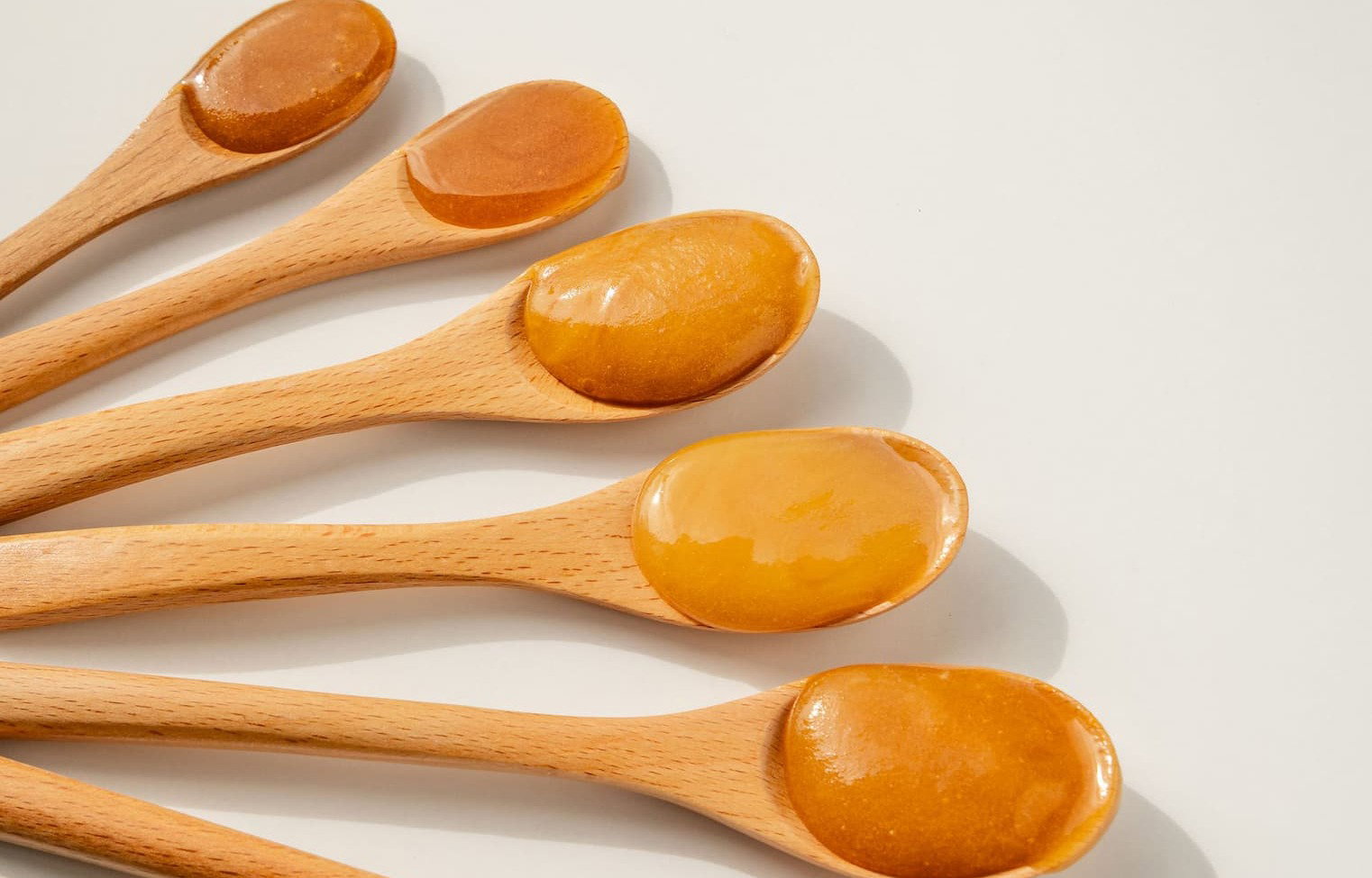 an image of a group of jars of honey sitting on a counter