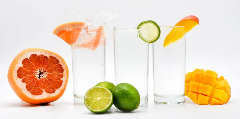 3 Glasses of Hard Seltzer with different fruits