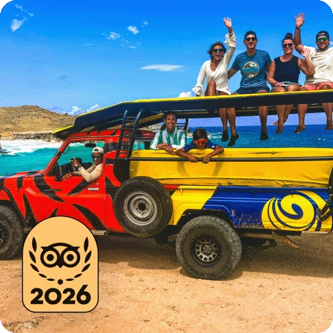 Image Description: A group of people in a colorful bus on the beach. A gold 2026 Travelers’ Choice Best of the Best badge is on the image.