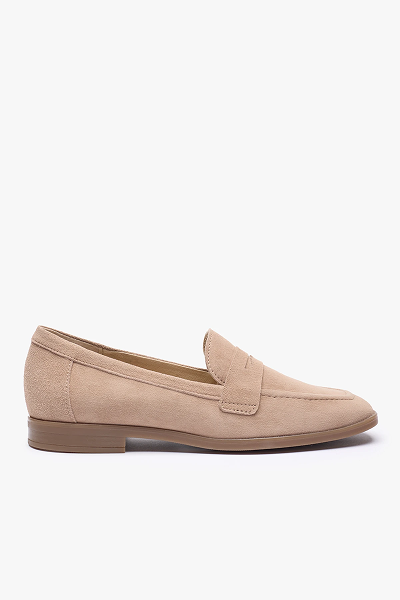 Beige suede loafer shoe with low heel on white background