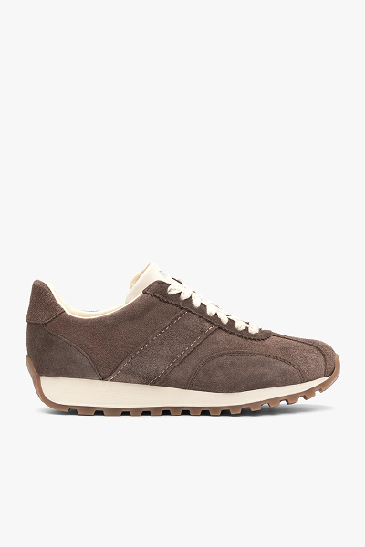 Brown suede trainer with white laces and gum sole on white background