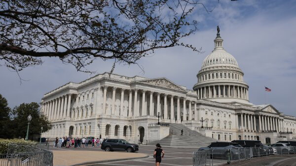 An individual jogs outside the U.S. Capitol in Washington, D.C.