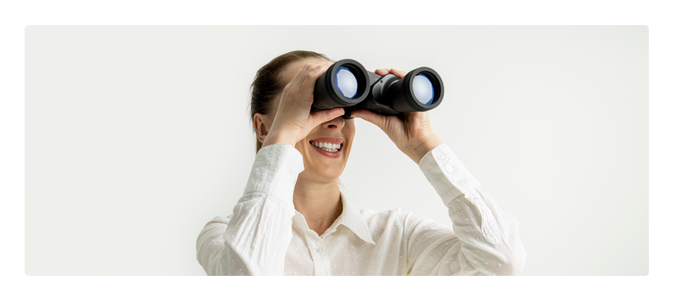 Woman looking through binoculars 