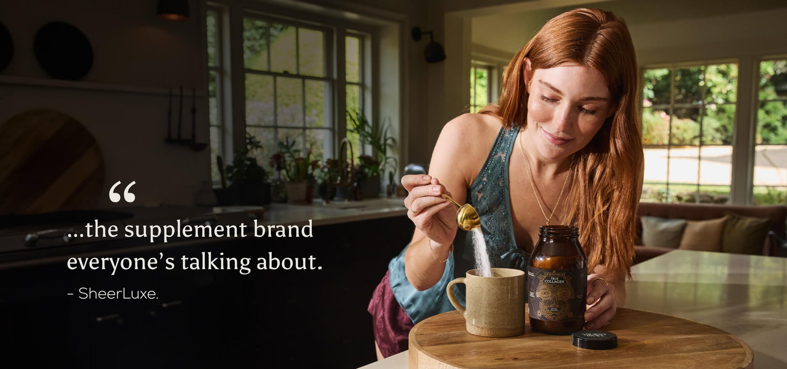 A woman scooping True Collagen in a mug. The quote is overlaid "...the supplement brand everyone's talking about." - SheerLuxe