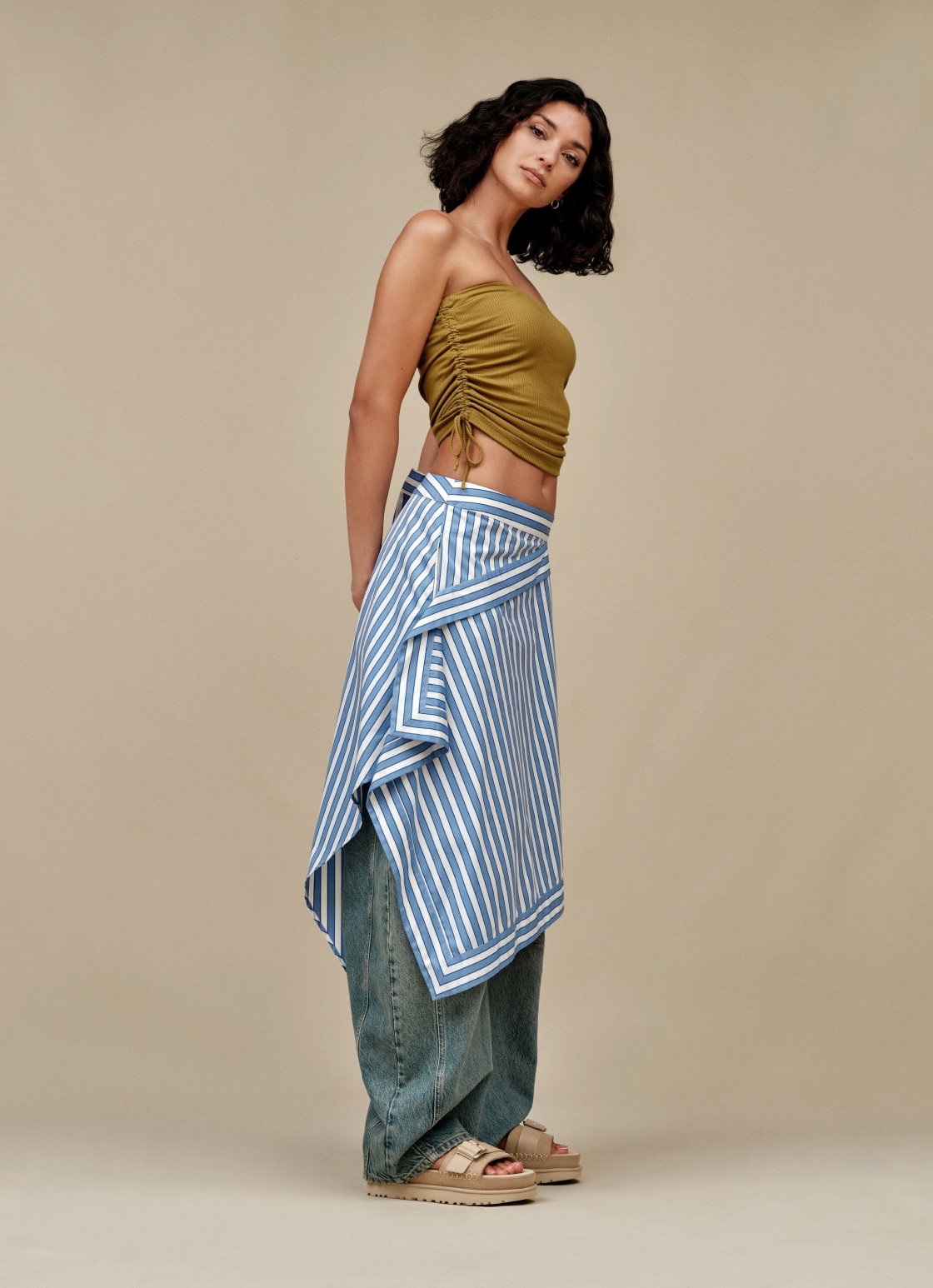 A studio shot of a model wearing the Women's Goldenstar Villa Sandal