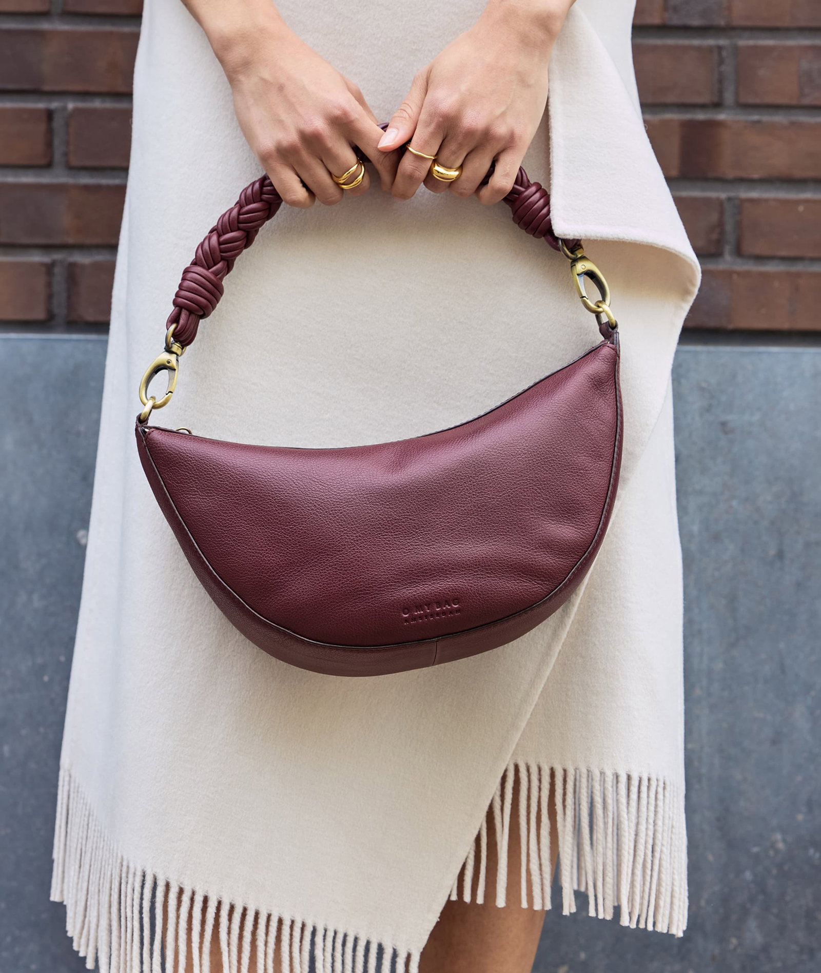 Woman wearing Leo Midi Twisted Handle in Dark Cherry