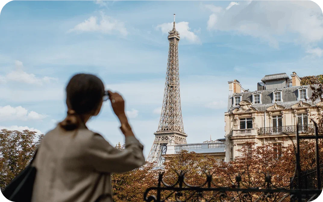 Person looking at the Eiffel Tower in Paris