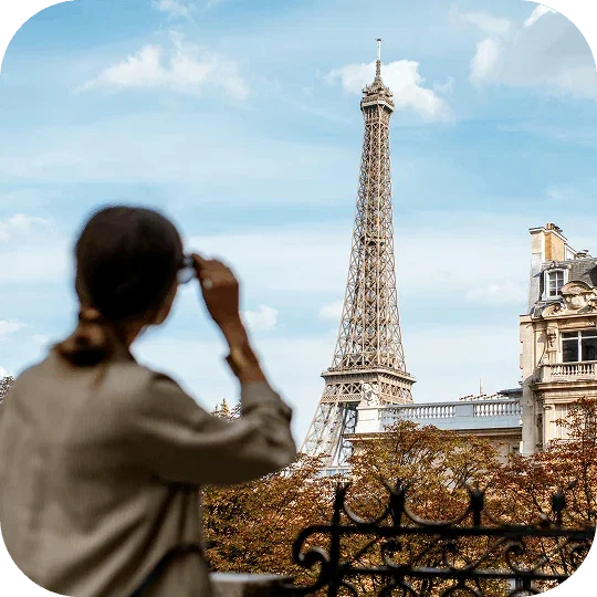 Person looking at the Eiffel Tower in Paris