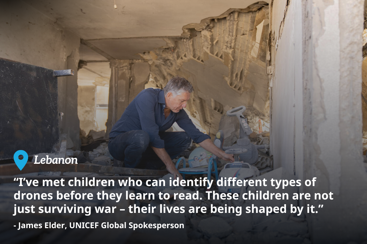 UNICEF Global Spokesperson James Elder looks through the rubble of a residential building that was destroyed by an airstrike in Lebanon