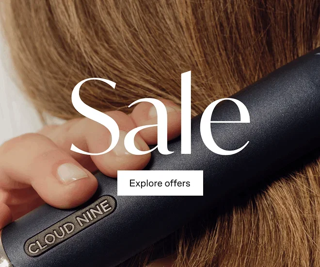 SALE with Explore offers button over hair with Cloud Nine straightener moving through it.