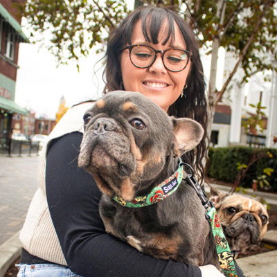 Woman and dogs with leashes on