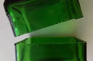 Cut glass bottles in half to copy this whimsical, $10 idea for your yard