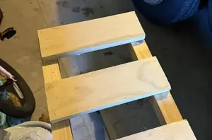 This mom stacked 2x2s in her garage for this display idea that also works as clever storage