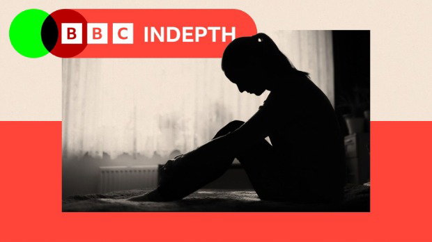 Black and white image shows the profile of a girl in silhouette sitting on a bed with her head bowed and her knees raised to her chest. The image has a red and pink border and the BBC InDepth logo in red and green is in the top left corner.