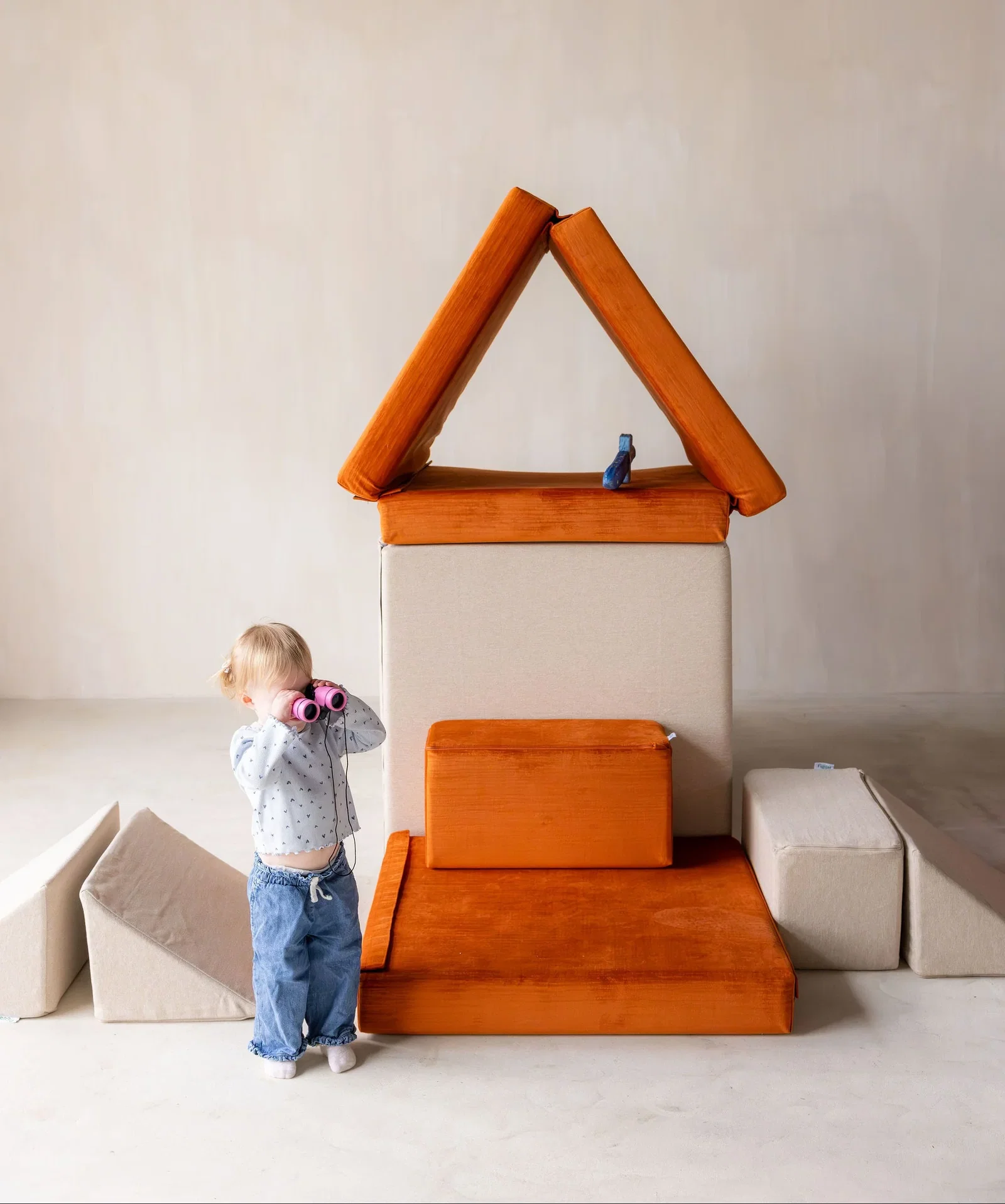 Boy jumping on Figgy play couch