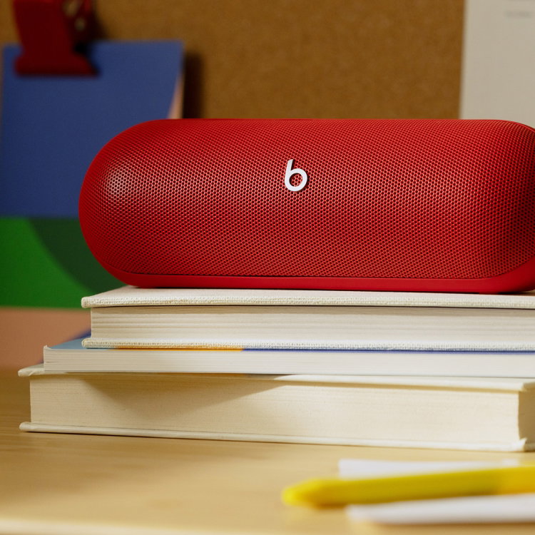 Beats Pill on a stack of books