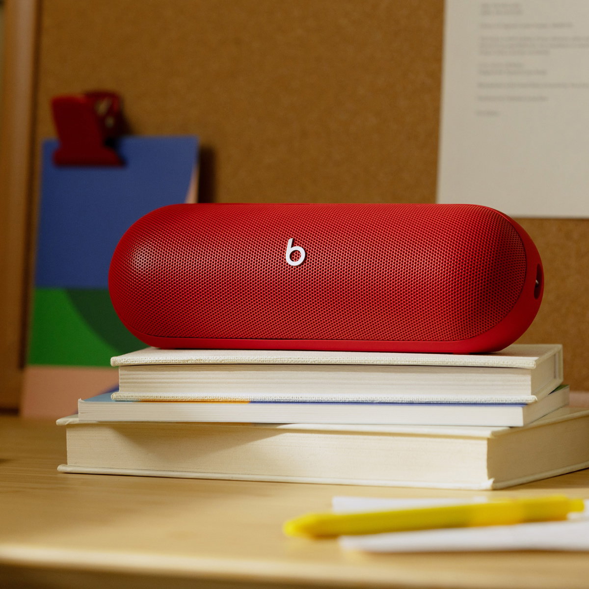 Beats Pill on a stack of books