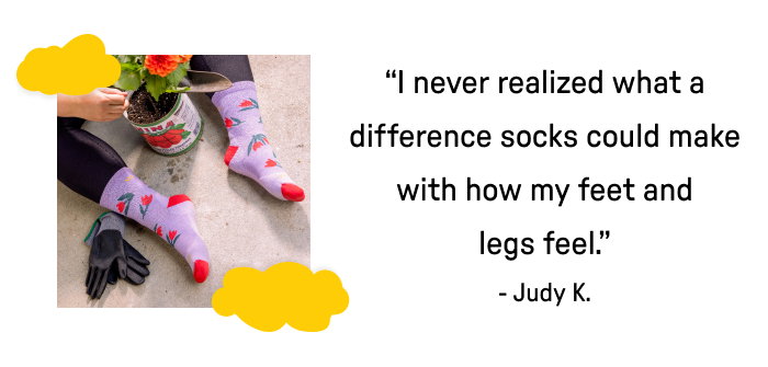Woman's feet wearing purple socks with red tulips surrounding a potted pland "I never realized what a difference socks could make with how my feet and legs feel"