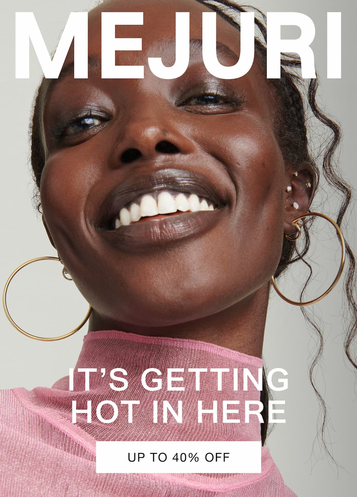 Woman smiling and wearing gold hoop earrings and pearl studs. Text reads: It's Getting Hot In Here — Up to 40% Off.
