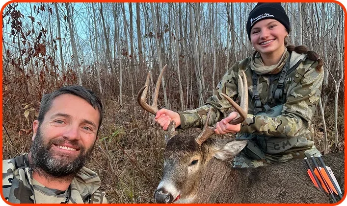 Father and daughter hunting deer