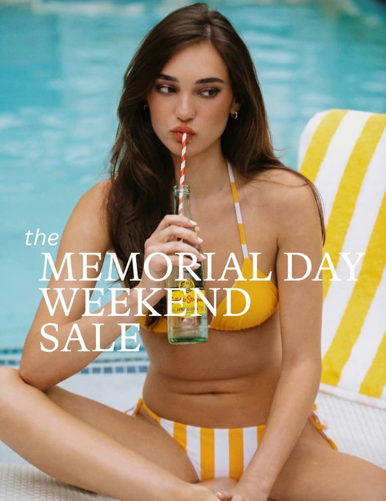 Women wearing a yellow bikini holding a glass bottle