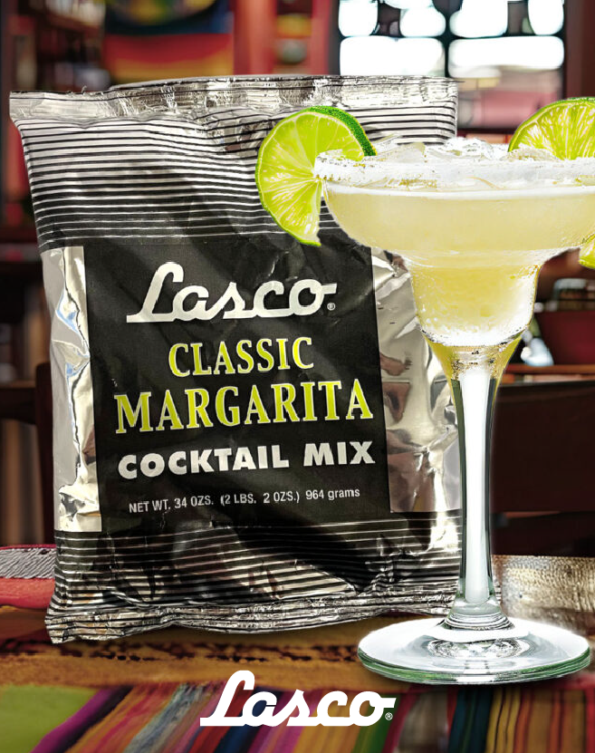 Lasco Classic Margarita cocktail mix pouch displayed beside a salted margarita glass with lime garnish in a bar setting.