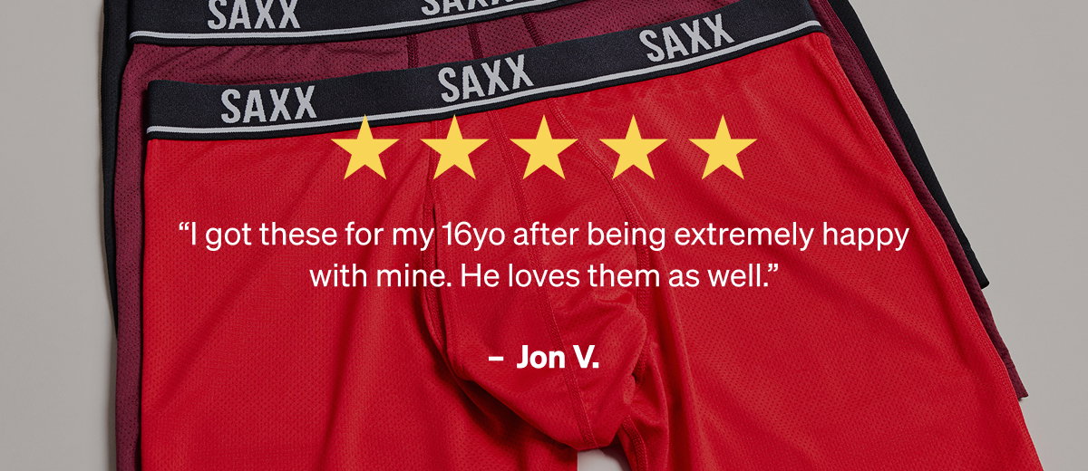 Five-star review by Jon V. overlaid on a stack of bright red and burgundy textured SAXX underwear.
