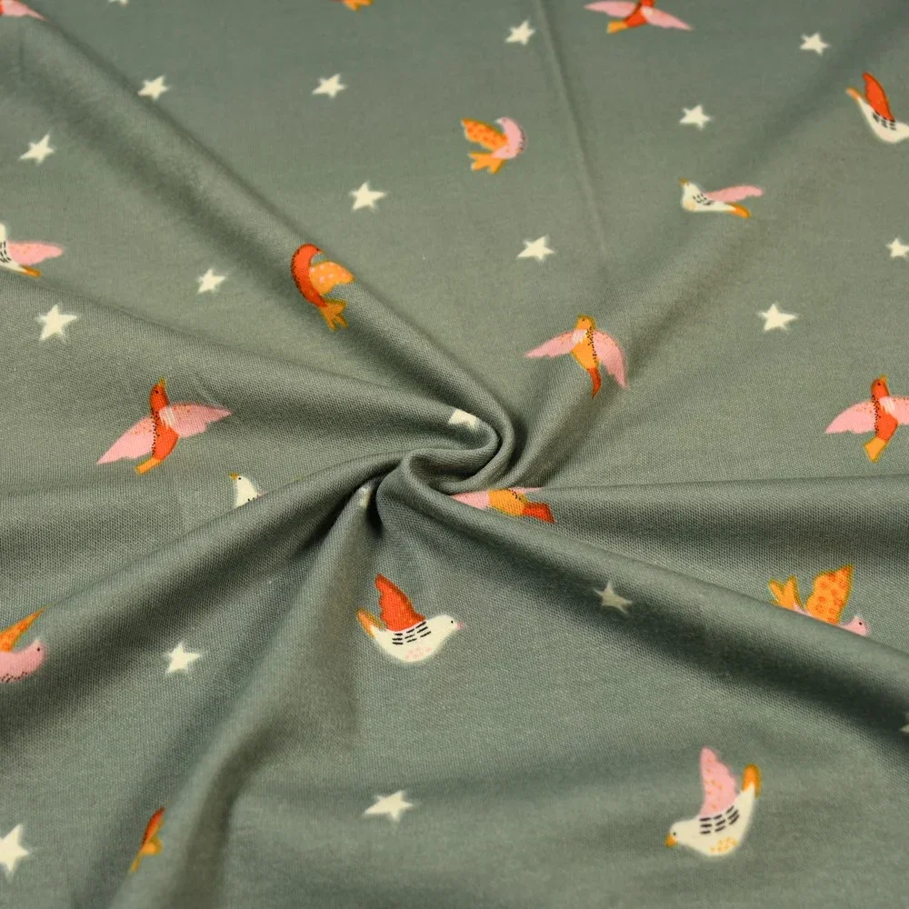 Image of Little Bird Print Cotton Jersey Fabric Green 150cm